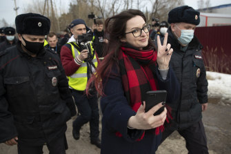 Activist Ksenia Pakhomova takes a selfie when she is detained outside prison.