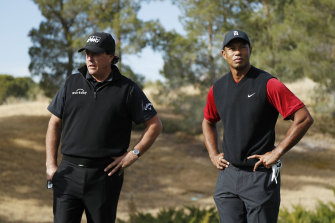 Phil Mickelson and Tiger Woods in happier times in 2018.