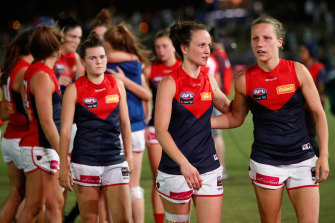 Demons despair: (from right) Karen Paxman, Daisy Pearce and Lily Mithen after the 2018 loss.
