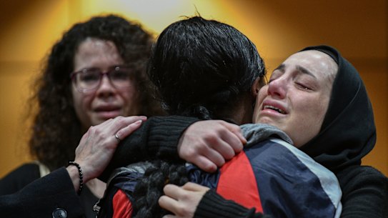 Friends and faculty members gather for a memorial service for the five students of the University of Windsor in Canada,who died in the Ukraine International Airlines crash.