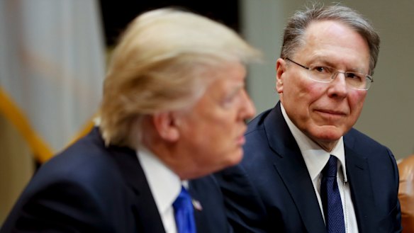 NRA head Wayne LaPierre, right, listens as President Donald Trump speaks in the  the White House in a file picture.