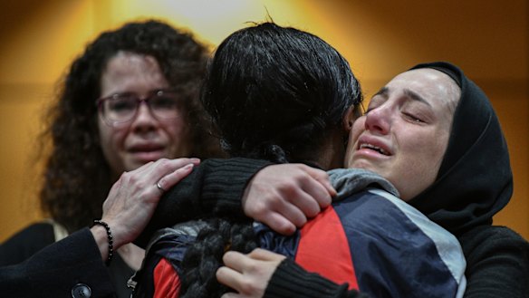 Friends and faculty members gather for a memorial service for the five students of the University of Windsor in Canada, who died in the Ukraine International Airlines crash.