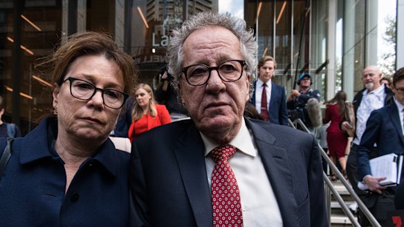 Geoffrey Rush and his wife Jane Menelaus leave the Federal Court in Sydney on Thursday. 