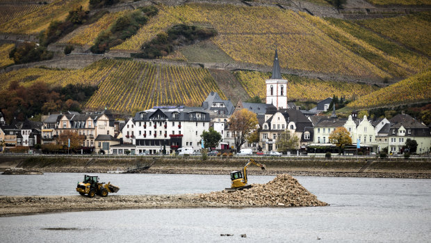 Repairs underway to a groyne during low water levels on the Rhine in Assmanshausen, Germany.
