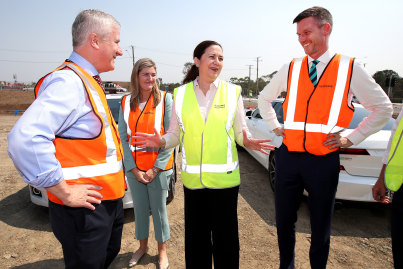 Deputy Prime Minister Michael McCormack, Minister Shannon Fentiman, Queensland Premier Annastacia Palaszczuk and Minister Mark Bailey announce infrastructure funds during a visit to a construction site in Rochedale on Wednesday.