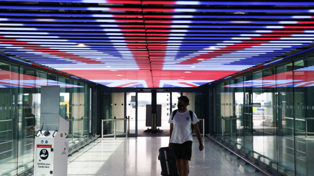 A traveller walks through Terminal 5 in London Heathrow Airport.