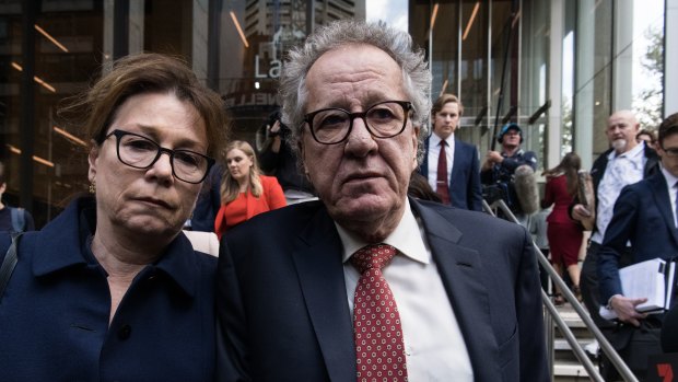 Geoffrey Rush and his wife Jane Menelaus leave the Federal Court in Sydney on Thursday. 