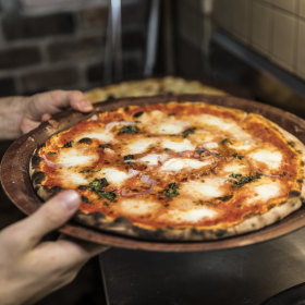 Hand stretched, thin crust wood fired pizza is the specialty.