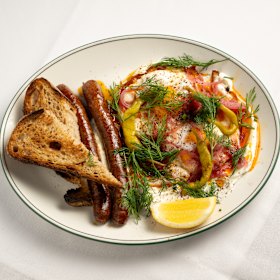 Turkish eggs with labneh, merguez sausage, and pickled peppers and onions.