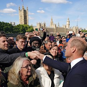 Prince William greets people in the queue to see the Queen lying in state
