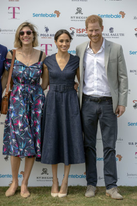 Nacho Figueras, an ambassador for his Sentebale charity, is slightly out of frame while  his fashion designer wife, Delfina Blaquier stands next to Meghan, with Prince Harry, (right).