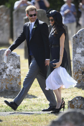 Cute combo ... Meghan, the Duchess of Sussex (pictured with Prince Harry), is making shirt dresses and skinny belts one of her go-to looks.