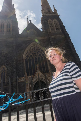Heather Ryan tied ribbons to the gates of St Patrick's Catherdral in support of victims of sexual abuse by the Catholic Church after the Pell verdict was announced.