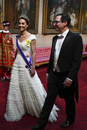 Catherine, the Duchess of Cambridge, and United States Secretary of the Treasury Steven Mnuchin arrive at the State Banquet at Buckingham Palace.