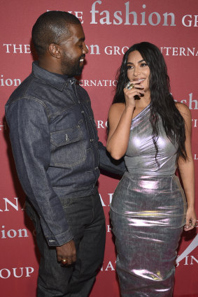 Kanye with wife Kim Kardashian at a fashion gala last week.