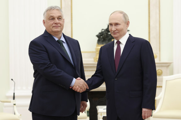 Russian President Vladimir Putin, right, and Hungarian Prime Minister Viktor Orban shake hands during a meeting in Moscow, Russia.