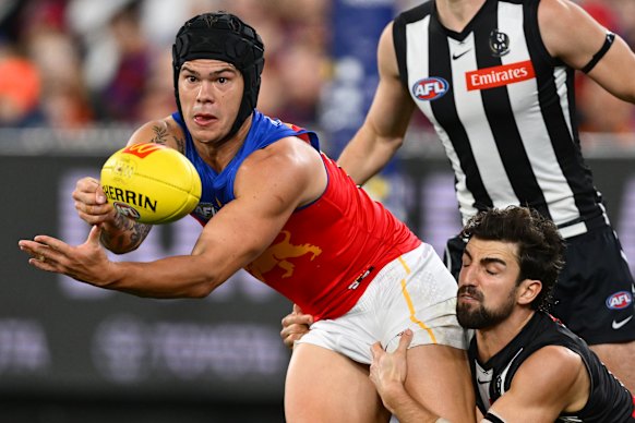Josh Daicos of the Magpies tackles Cam Rayner of the Lions.