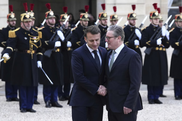 United for Ukraine: French President Emmanuel Macron greets British Prime Minister Keir Starmer at the Elysee Palace in Paris on Monday.