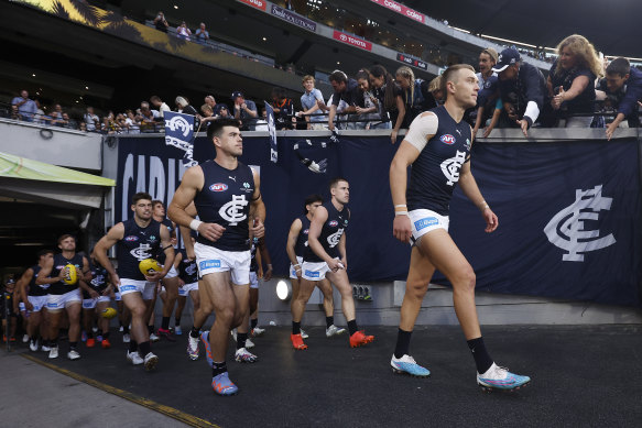 Carlton skipper Patrick Cripps leads his team out.