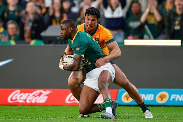 South Africa’s Aphelele Fassi, front, is challenged by Australia’s Joseph-Aukuso Suaalii.