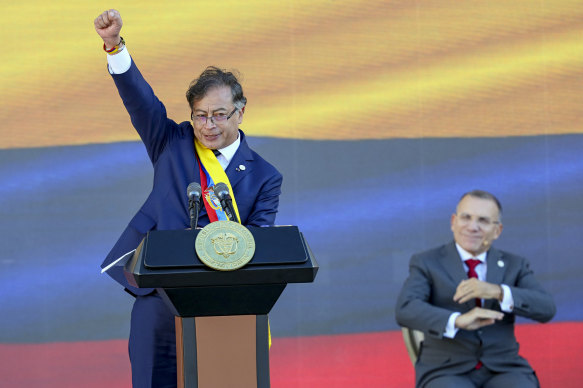 President Gustavo Petro raises his fist at the end of his inauguration speech in Bogota, Colombia.