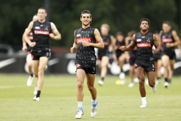 Nick Daicos warms before a pre-season training session. 