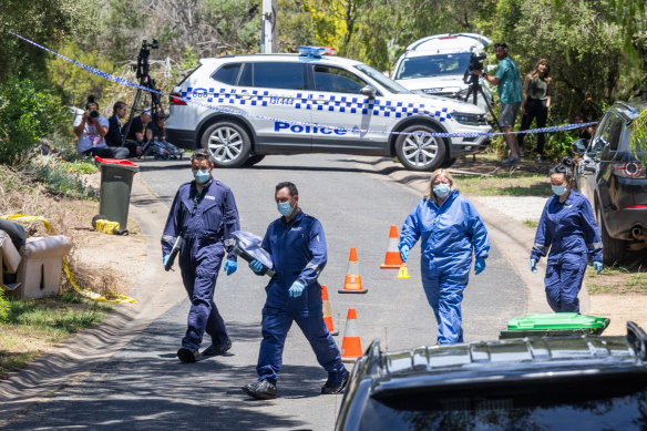 Forensic officers at the scene on Monday. 