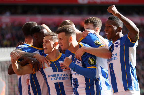 Leandro Trossard of Brighton & Hove Albion celebrates with team mates after scoring their sides first goal during the Premier League match between Liverpool FC and Brighton & Hove Albion.