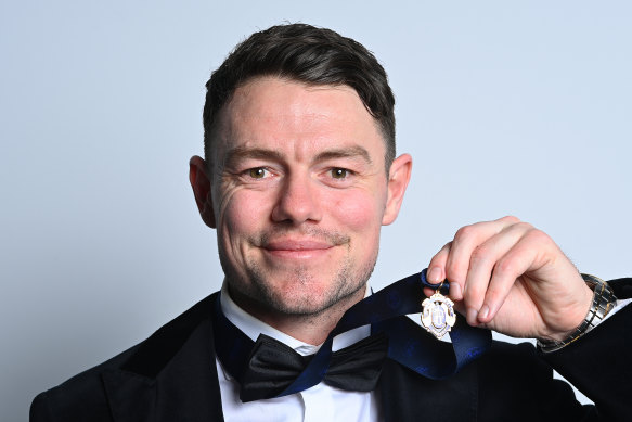 Neale shows off his prized medal after picking up a Brownlow for a second time. 