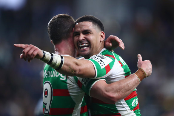Cody Walker and Damien Cook celebrate a try.