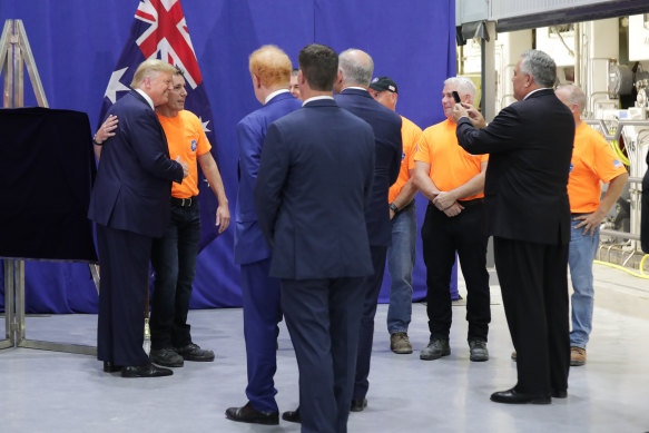 Joe Hockey takes a photo of the US president Donald Trump and a worker during the official opening of businessman Anthony Pratt’s recycling and paper plant in Ohio, during the prime minister Scott Morrison’s state visit to the US in 2019.