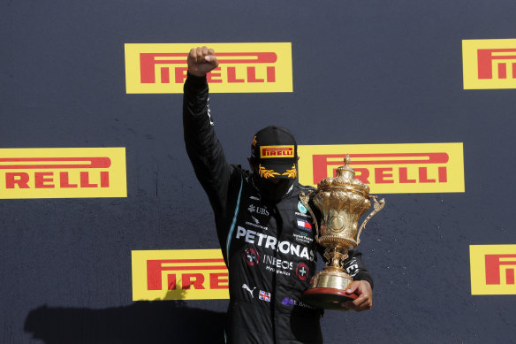 Mercedes driver Lewis Hamilton on the podium after winning the British Formula One Grand Prix at Silverstone on Sunday.