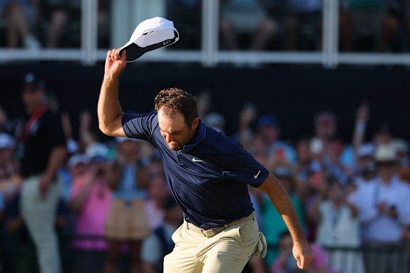 Scottie Scheffler celebrates on the 18th green.