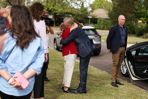 Filomena Knerr hugs Albanese after he visited her home in Canberra early in the campaign.
