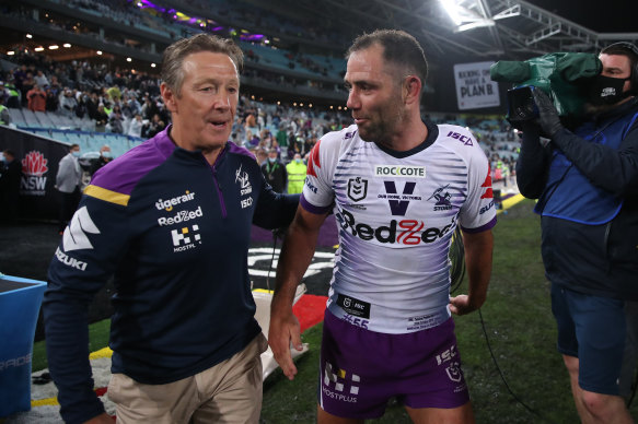 Storm champion Cameron Smith and Craig Bellamy celebrate after last year’s grand final win. 