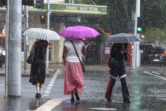 Torrential rain hits Lygon Street at 2.55pm.