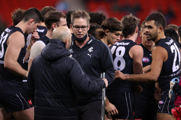 Carlton coach David Teague walks away after talking to his players during the loss to Greater Western Sydney.