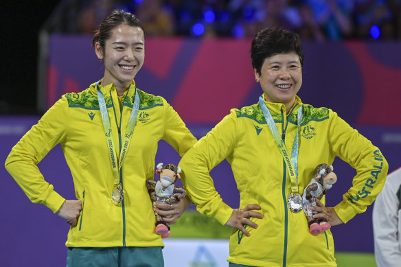 Minhyung Jee and Jian Fang Lay, right, of Australia react on the podium after receiving their silver medals.
