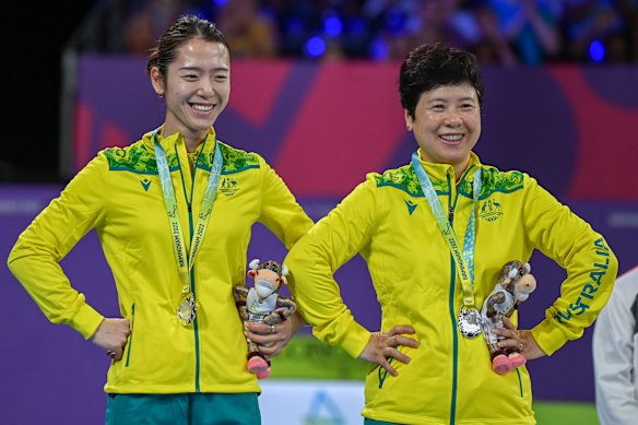 Minhyung Jee and Jian Fang Lay, right, of Australia react on the podium after receiving their silver medals.