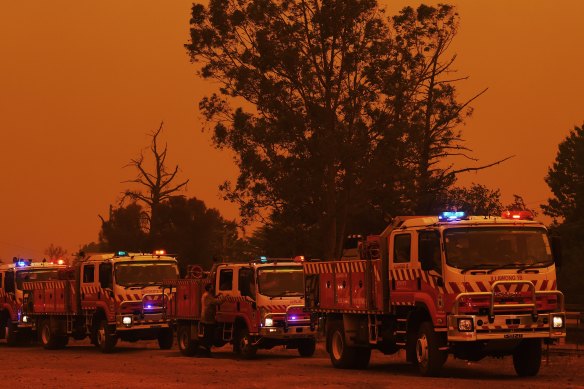 Fire trucks in Buxton as the Green Wattle Creek fire approaches the town.
