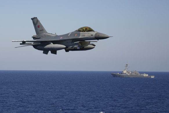 A Turkish F16 flies over naval ships during an annual NATO naval exercise on Turkey’s western coast on the Mediterranean last year.