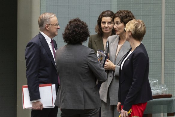 Prime Minister Anthony Albanese with independent MPs Monique Ryan, Allegra Spender, Kate Chaney and Zoe Daniel in discussion after a division in the House of Representatives at Parliament House in Canberra last year.
