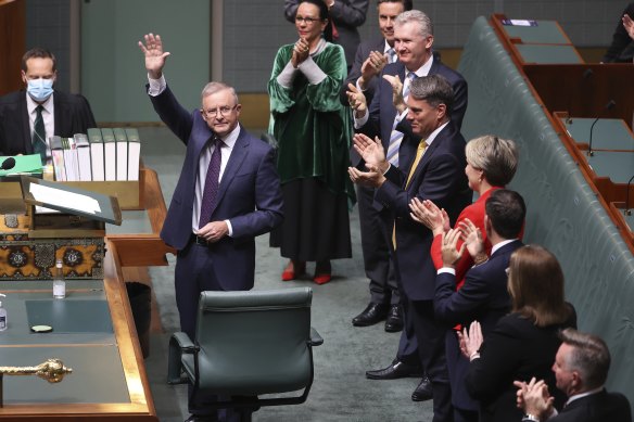 Opposition Leader Anthony Albanese is applauded by colleagues after delivering the budget reply in the House of Representatives last month. 