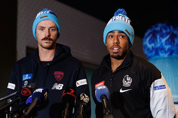 Jake Lever of the Demons and Isaac Quaynor of the Magpies speak to the media.