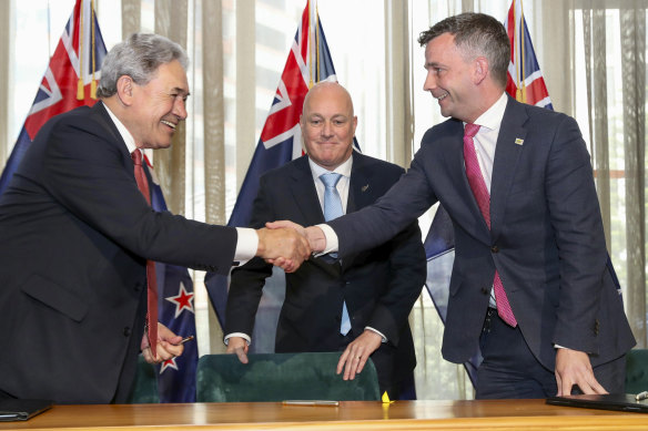 New Zealand Prime Minister Chris Luxon (centre) with coalition partners, NZ First leader Winston Peters (left) and ACT leader David Seymour.