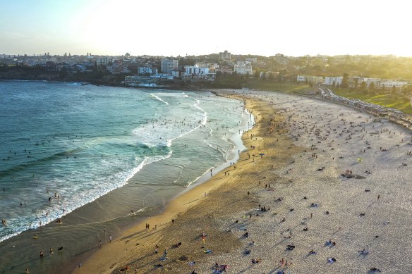 Beachgoers embrace the weather at Bondi on Tuesday.