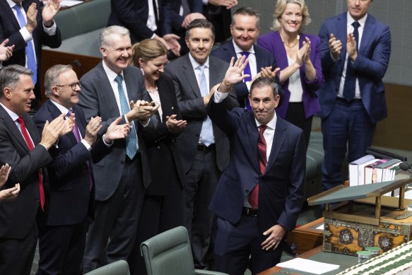 The Labor caucus applaud after Treasurer Jim Chalmers concludes his budget address.