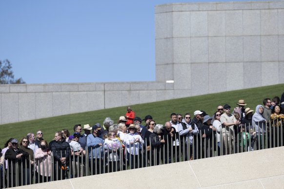 Members of the public watching the proclamation ceremony for King Charles III, at Parliament House in Canberra.