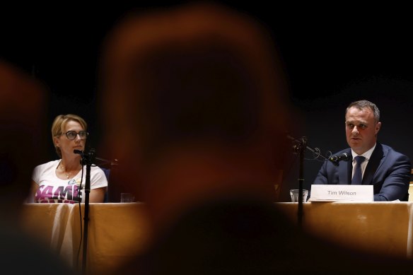 Zoe Daniel looks on as Tim Wilson speaks on Thursday evening.