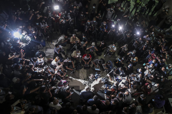 Former Malaysia prime minister Najib Razak, centre, speaks to journalist before leaving the Kuala Lumpur High Court complex in Kuala Lumpur after his sentencing last year.